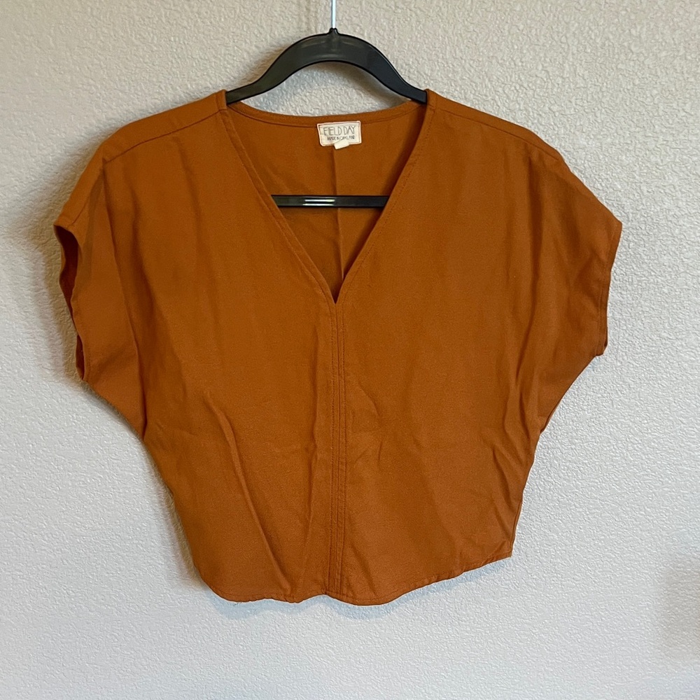 Elegant Rust Blouse by [Brand]